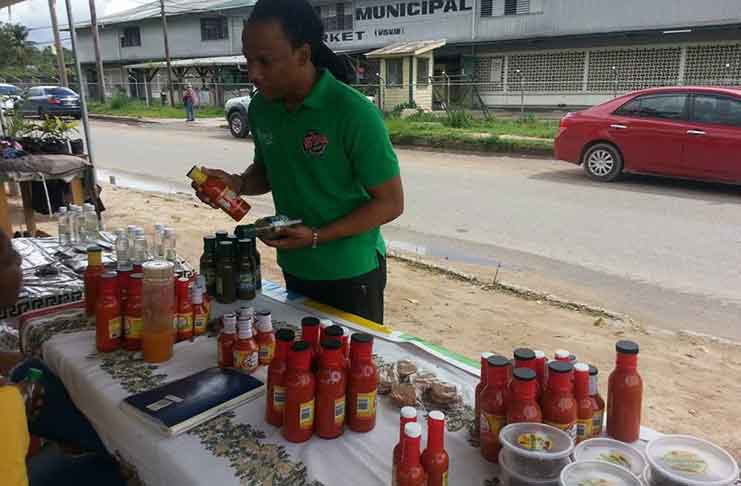 Member of Parliament Jermaine Figueira purchasing a variety of products from Pleasurable Flavours