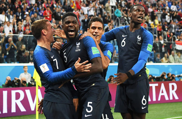 France's Samuel Umtiti celebrates with teammates after heading in the first goal, that eventually proved to be the match-winning goal, during the 2018 FIFA World Cup semi-final against Belgium at Saint Petersburg Stadium in Saint Petersburg, Russia, on Tuesday. Photograph: Shaun Botterill/Getty Images