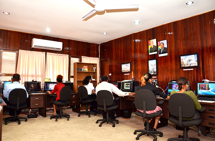 Members of the Monitoring and Compliance Department at work