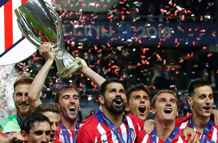 Atletico Madrid celebrate with the trophy after winning the Super Cup REUTERS/Maxim Shemetov