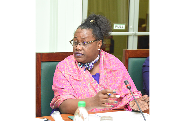 Minister Simona Broomes addressing members of the NIS team on Monday (Samuel Maughn photo)