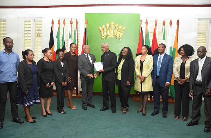 President David Granger receives the Lindo Creek Commission of Inquiry (COI) Report from Chairman of the Commission, Justice (ret’d) Donald Trotman (left). 
Also present in the photograph are other members of the COI Commission who attended the ceremony at State House on Thursday morning (Samuel Maughn photo)