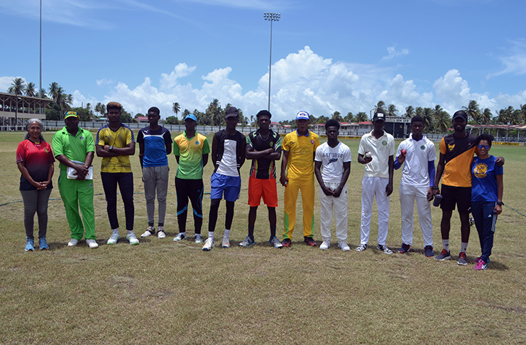 The nine fast bowlers with coach Smith (in green), two representatives from Flow Sport (far left and right), Akeem Dewar in black and gold.