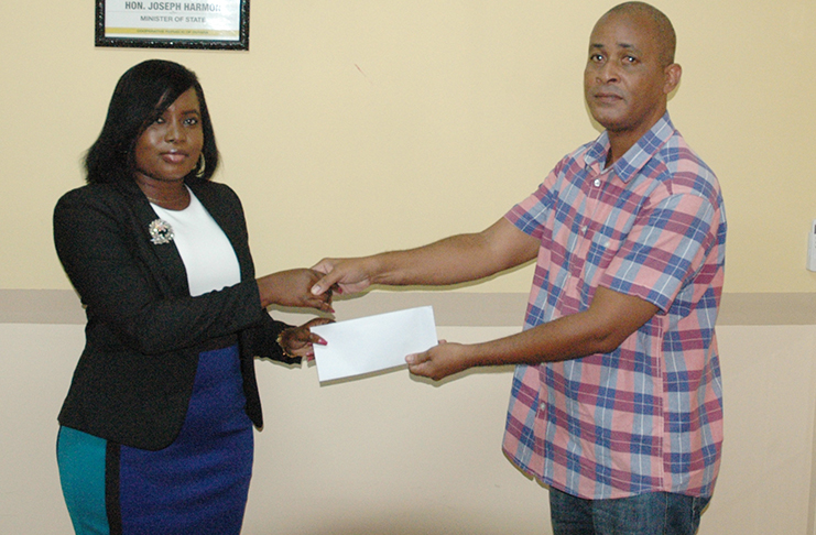 Organiser Rawle Welch (right), and Gaming Authority’s Compliance Officer Towana Whinfield