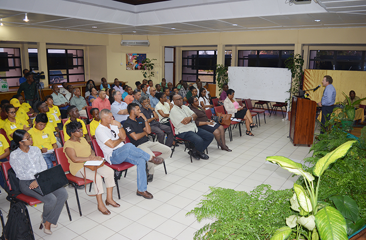 Mining Specialist Dr. Bruce Marshall addressing the gathering of mining officials and students at the presentation.
