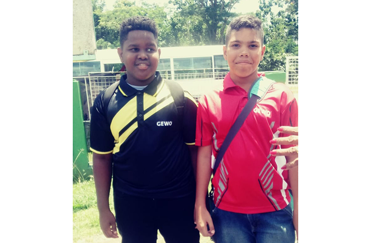 Kaysan Ninvalle (left) and Jonathan Van Lange were yesterday morning snapped at the Cliff Anderson Sports Hall just before leaving for the Dominican Republic.