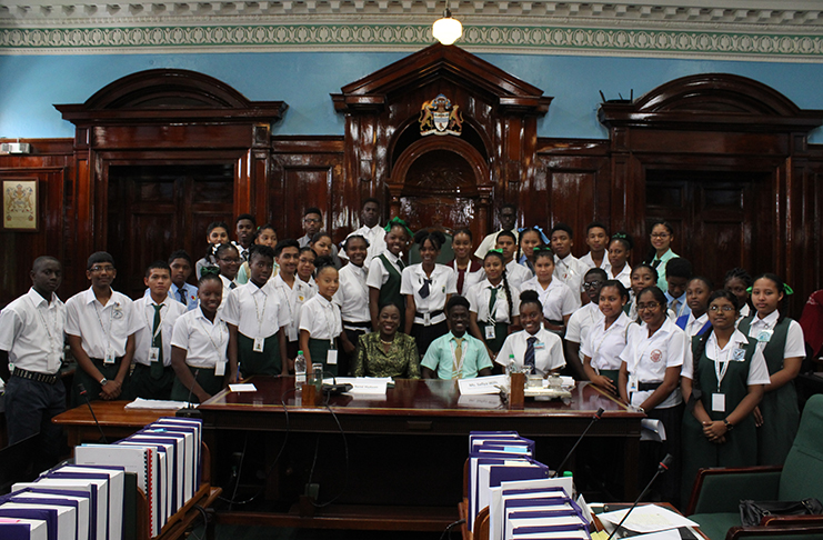 The secondary school youth parliamentarians pose with Minister of Education, Nicolette Henry
