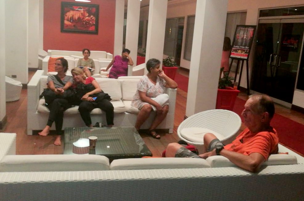 Guests sit in the lobby of the Pegasus Hotel, Kingston, Georgetown
