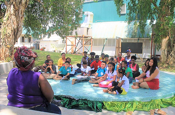 Dowding teaches a class in the Eucalyptus Garden aback Theatre Guild