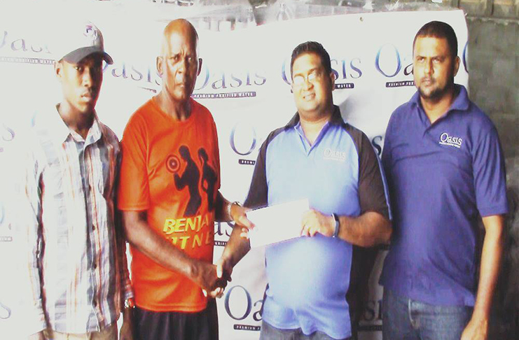 GBI’s Brand Manager Raymond Govinda (second from right) hands over the sponsorship package to FACC’s Randolph Roberts,
