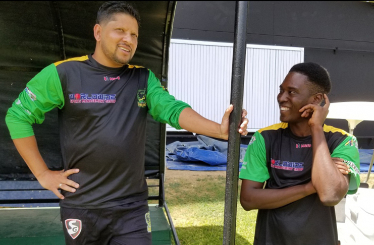 Ramnaresh Sarwan having a chat with a Tallawahs squad member, at Sabina Park on Wednesday