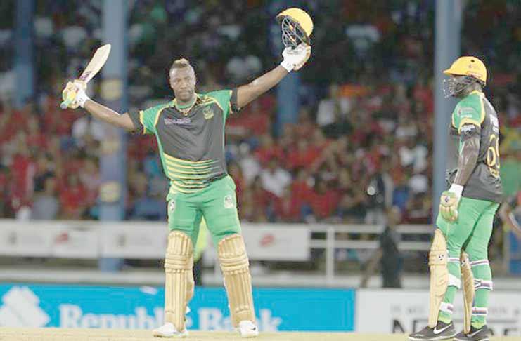 Jamaica Tallawahs captain Andre Russell celebrates his hundred against TKR in the third match of the Caribbean Premier League at Queen’s Park Oval on Friday night. (Photo courtesy CPL)