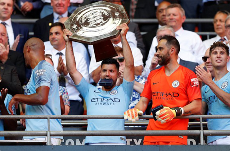 Manchester CityÕs Sergio Aguero celebrates winning the community shield with the trophy Action Images via Reuters/John Sibley