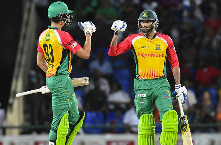 Sohail Tanvir and Chris Green (left) celebrate Amazon Warriors victory at Warner Park.(CPL photo).
