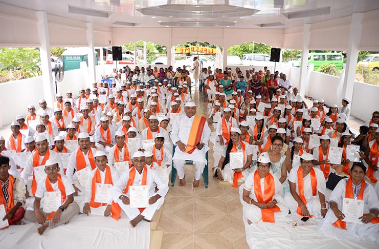 (At Centre) Dr. Satish Prakash flanked by students who display their certificates at the Maharishi Dayananda Gurukula at the Arya Samaj Temple, Windsor Forest West Coast Demerara. (Delano Williams Photo)