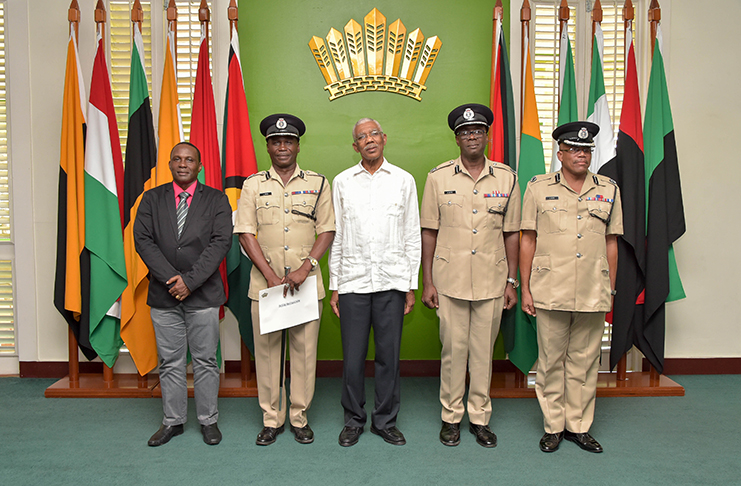 President David Granger poses with new Commissioner of Police, Leslie James ( second from left) along with the other deputy commissioners