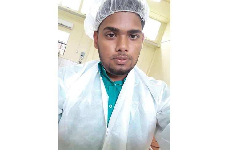 Shaveshwar Deonarine in his lab coat while at work
