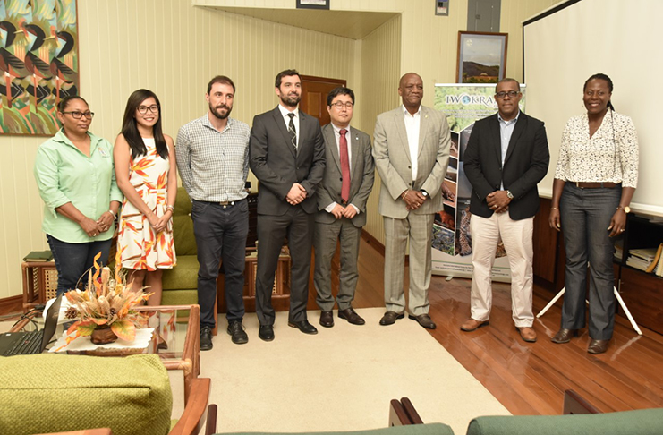 Minister of State Joseph Harmon and other officials during the meeting