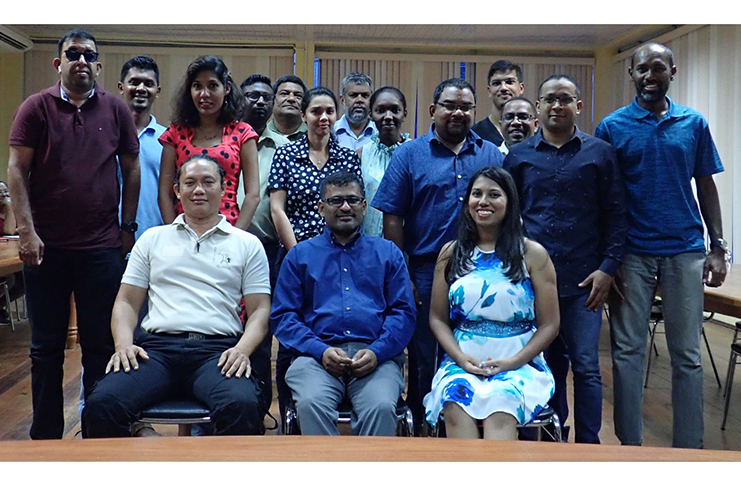 Newly elected Board of Directors, seated, pose with some of the attendees at the AGM 2018.