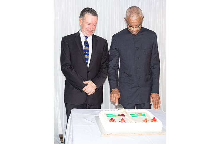 President David Granger and Ambassador Lineu Pupo de Paula cut the ceremonial cake to mark the two anniversaries (Photos by Delano Williams)