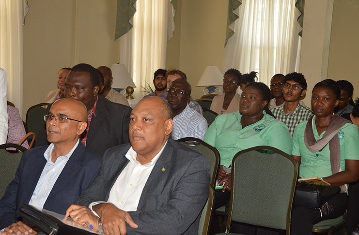 Natural Resources Minister Raphael Trotman and CI-Guyana Vice President David Singh seated during the launch of the project (Adrian Narine photo)