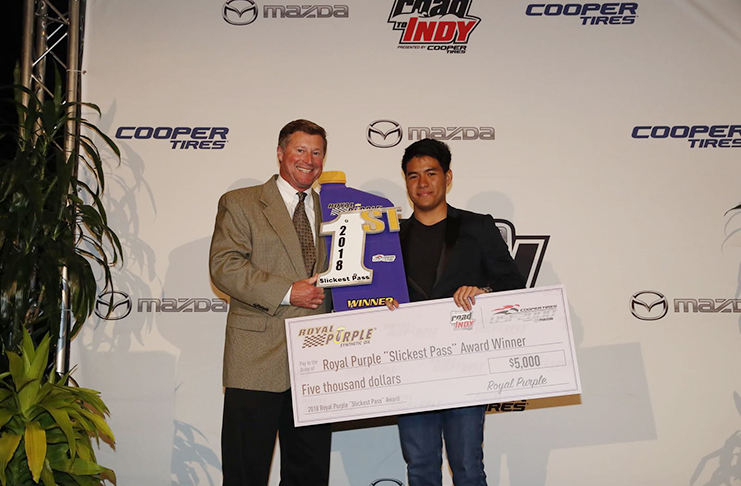 Calvin Ming collects his cheque for the slickest pass of the USF2000 series 2018.