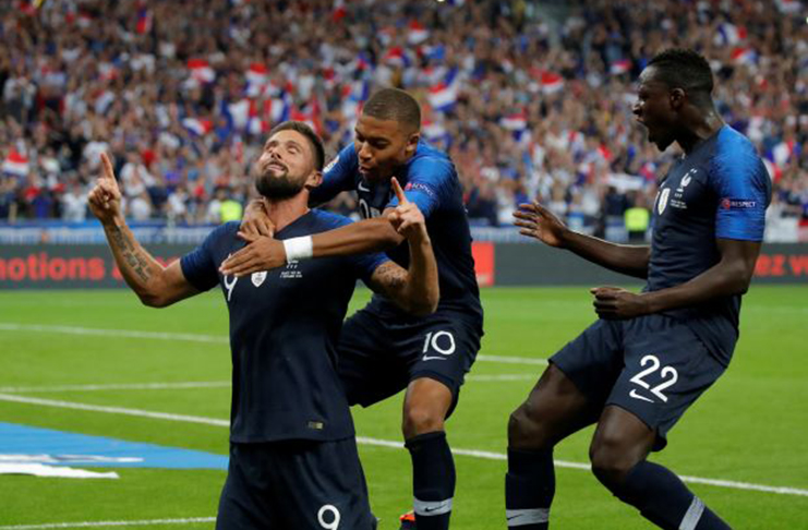 France's Olivier Giroud celebrates with Kylian Mbappe and Benjamin Mendy in Nations League match against the Netherlands at Stade de France, Saint-Denis, France – (REUTERS/Charles Platiau/File Photo)