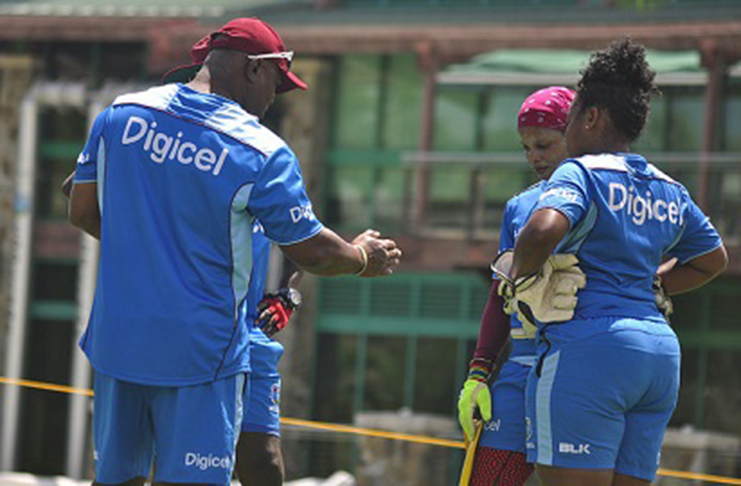 Head coach Hendy Springer (left) makes a point during a recent training camp.