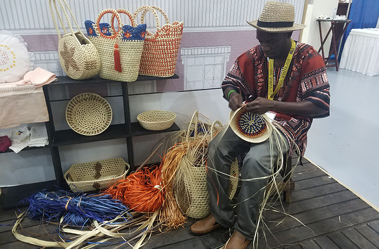 Omar Daley weaving one of his bags