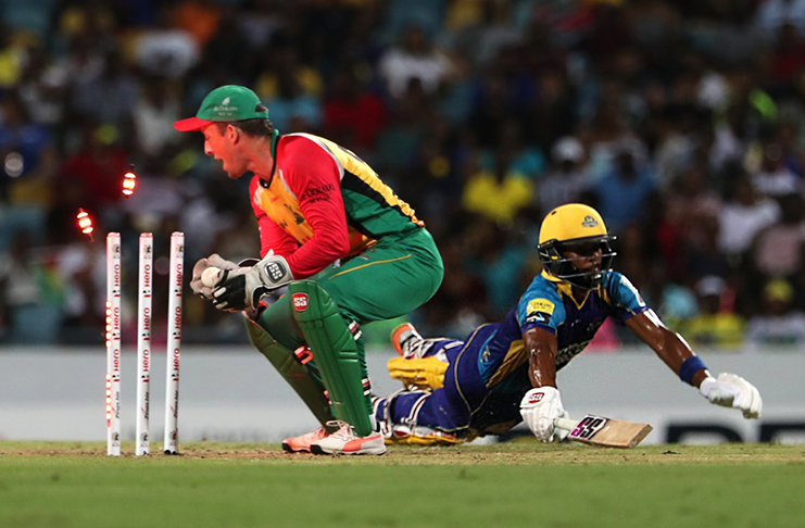 Tridents batsman Shai Hope is run-out by wicketkeeper Luke Ronchi for 34. (CPL photo)