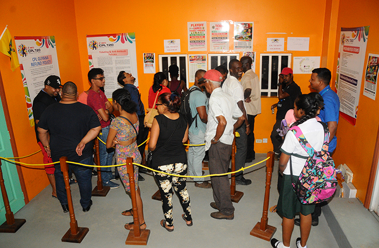Cricket-lovers in their numbers yesterday at the local ticketing office, located at 238 Camp and Quamina Streets, Georgetown. (Adrian Narine photo)