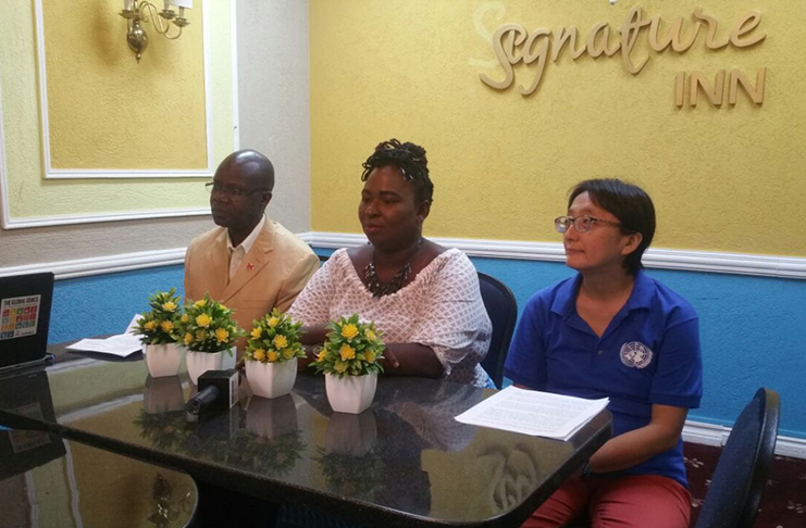 UNAIDS Country Director for Guyana and Suriname, Dr. Martin Odiit; Executive Director of Guyana Trans United, Quincy McEwan and UN Resident Coordinator, Mikiko Tanaka, addressing media operatives on Saturday during the one-day training seminar