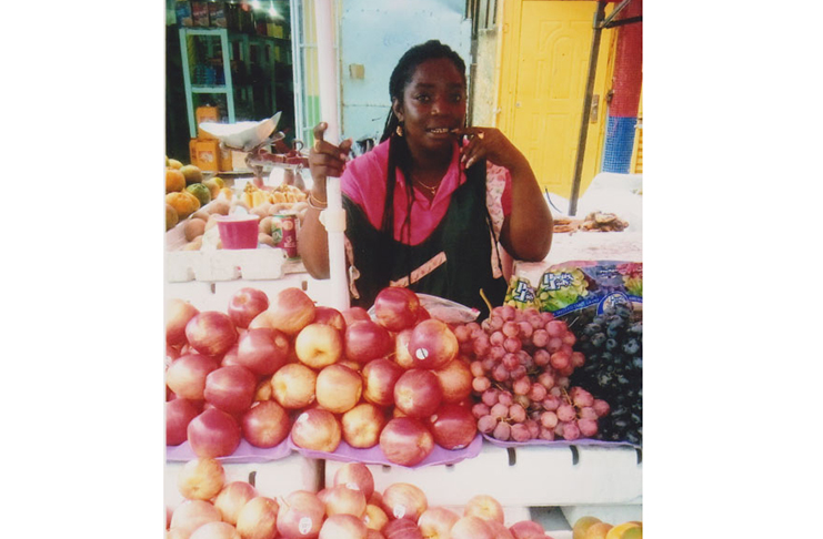 Melissa Roberts at her fruit stand at the Bourda Market