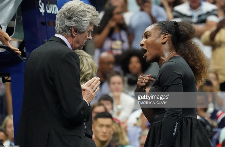 Serena Williams of the United States argues with referee Brian Earley, during her Women's Singles finals match against Naomi Osaka of Japan at the 2018 US Open at the USTA Billie Jean King National Tennis Centre in New York on September 8, 2018. - Osaka, 20, triumphed 6-2, 6-4 in the match marred by Williams's second set outburst, the American enraged by umpire Carlos Ramos's warning for receiving coaching from her box. She tearfully accused him of being a 'thief' and demanded an apology from the official. (Photo by TIMOTHY A. CLARY / AFP)