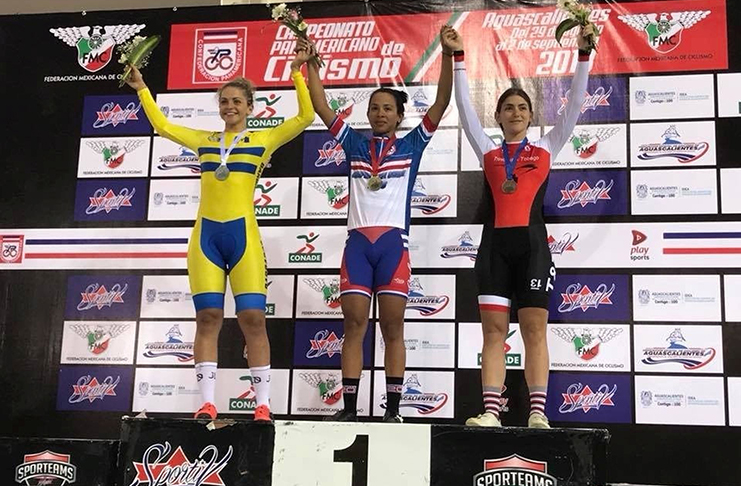 A proud moment for Alexi Costa, right, as she stands on the podium and receives the Caribbean Championship bronze medal when she represented T&T in the Scratch Race event in spite of a serious crash at the finish at the Elite Pan Am Championships in Mexico on Thursday last.