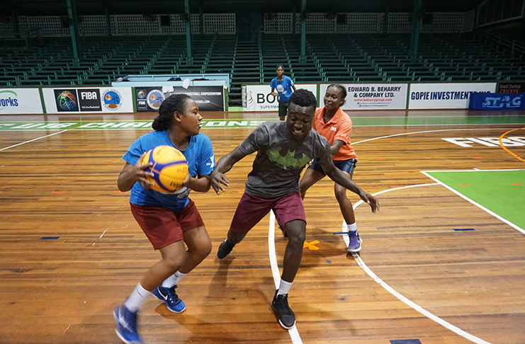 Guyana’s male and female players during a recent practice session at the Cliff Anderson Sports Hall