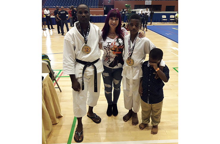 Niquann Fevrier and Sensei Troy Bobb with famous movie star and Grand Master in Martial Arts, Cynthia Rothrock