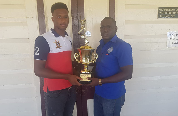 DCC captain Lawrence Smith and GCC Ronaldo Alimohamed pose with the winning trophy.