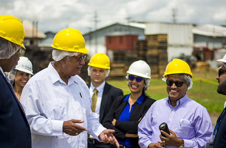 Minister of Agriculture Noel Holder with DDL Chairman Komal Samaroo, other DDL officials and Tetra Pak representatives during a discussion