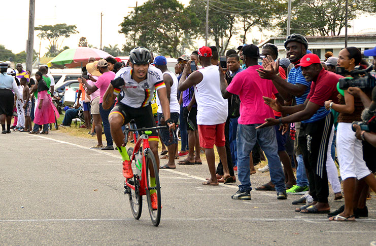 Team Evolution’s Paul DeNobrega celebrates as he crosses the finish line to claim the eighth edition of the Digicel Cancer Awareness Cycling Meet. (Adrian Narine photo)