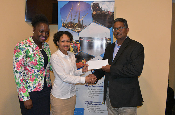 Gaico’s Managing Director Komal Singh presents sponsorship cheque to national player Lakeisha Pearson in the presence of GFF’s Third vice-president Thandi McAllister.