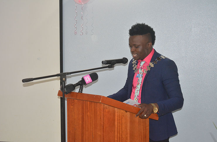 Junior Chambers International Guyana President Kevin Cornette giving his remarks at the organisation's breast cancer awareness dinner.