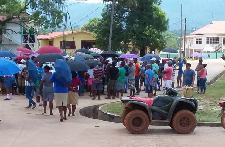 A large gathering of residents outside the office of the Guyana Geology and Mines Commission (GGMC) at Mahdia, as they protest the recent mining enforcement operation