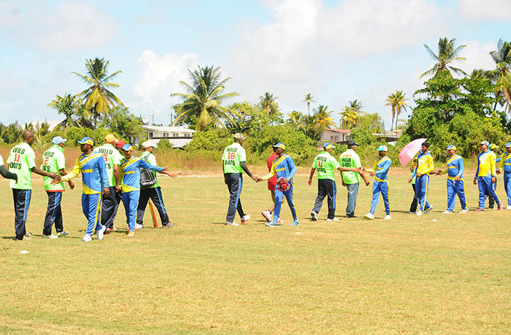 Ariel Speedboat team members congratulate the Cotton Field Wild Oats players after their convincing 49-run win. (Adrine Narine photos)