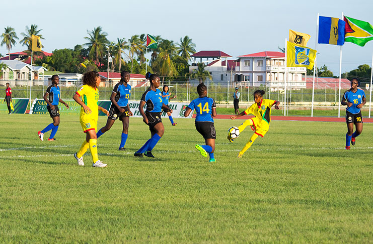 Guyana’s Jalade Trim in action against Barbados, at the National Track and Field Centre in the CONCACAF Girls U-17 Qualifying Championship. (Samuel Maughn photo)