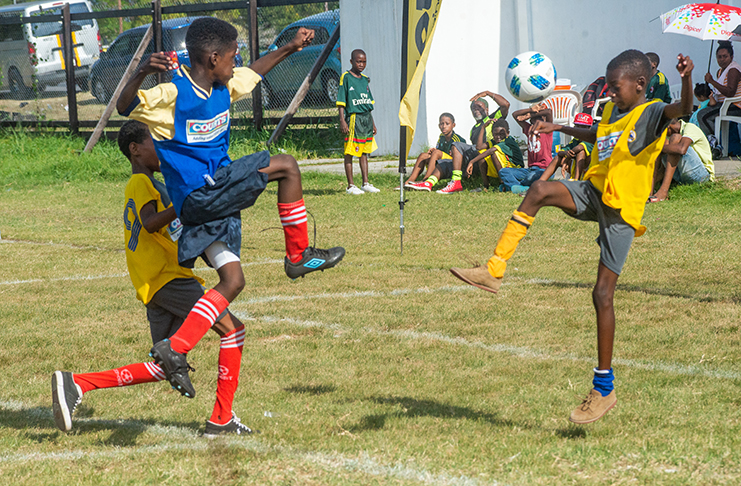 Part of the action in the COURTS Pee Wee football tournament between Marian Academy and BV. (Delano Williams photo)
