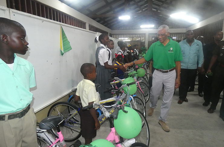 President David Granger presenting bicycles to the Linden students
