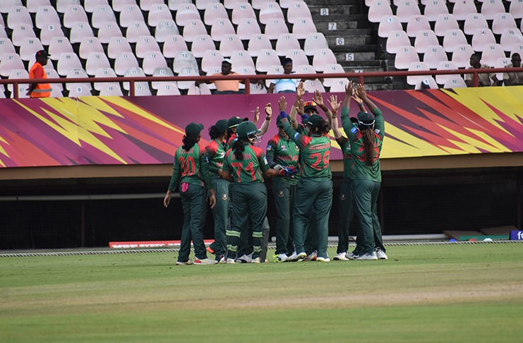 Bangladesh players celebrate a wicket after winning the toss at Providence on Sunday (John Ramsingh photo)