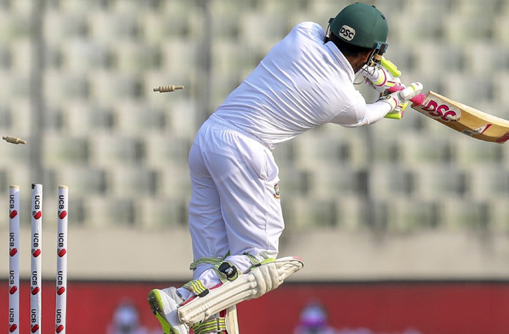 The ball sneaks through Mushfiqur Rahim's intended drive to shatter the stumps, Bangladesh v West Indies, 2nd Test, 1st day, yesterday. (AFP)