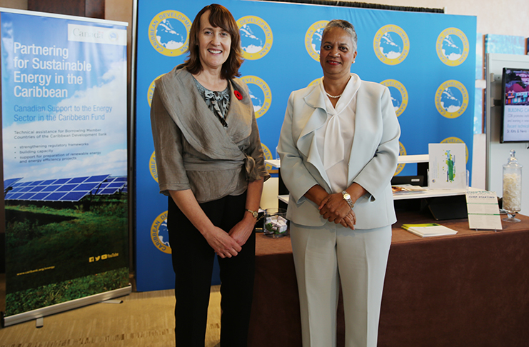 (L-R) Canada’s Ambassador for Climate Change, Patricia Fuller, and Vice-President (Operations), CDB, Monica La Bennett, pose for a photo at the CDB booth during the Caribbean Renewable Energy Forum, held in Miami, Florida, from November 7 to 9, 2018.